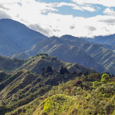 Tierradentro, Inza, Cauca, Colombia.  Beautiful landscape of the Andes Mountains. Valley, lush vegetation, peak, crops. Picture taken from the Alto del Aguacate.