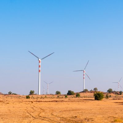 Windmills in the desert of Rajasthan near Jaisalmer. These are part of the clean energy projects in the region and provide sustainable renewable energy from desert winds