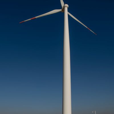 Sunset view of wind power plant. Vast turbine wind mills farm at jhimpir